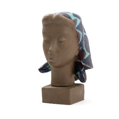 a-terracotta-bust-in-the-shape-of-a-woman-with-a-headscarf