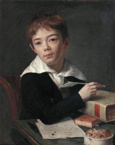 portrait-d-un-jeune-garcon-a-son-bureau