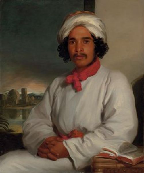 portrait-of-a-youth-seated-half-length-wearing-a-white-turban-and-an-red-scarf-with-a-temple-beyond