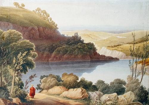 a-woman-by-a-lake-with-an-extensive-view-beyond