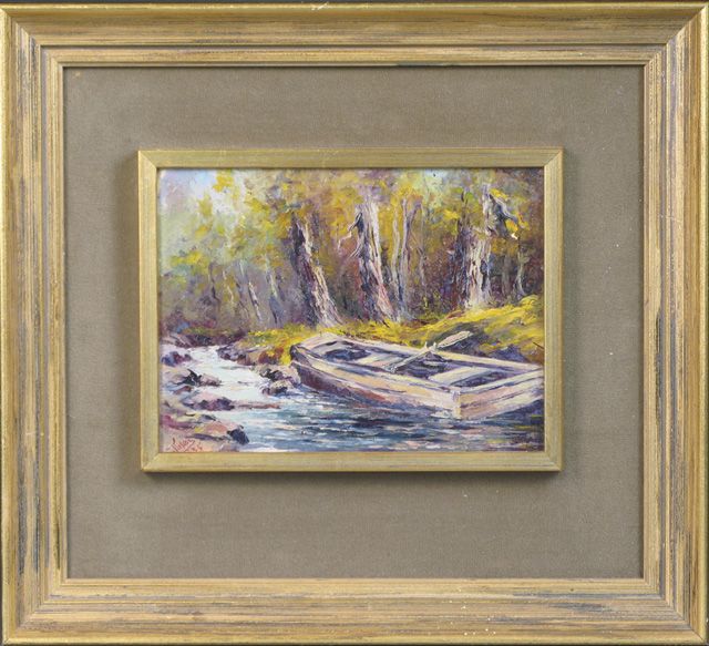 an-autumn-landscape-with-rowboat-beached-in-narrowing-stream