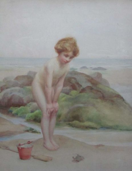 a-young-girl-encountering-a-crab-on-a-beach