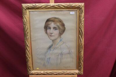 portrait-of-a-lady-wearing-blue-dress