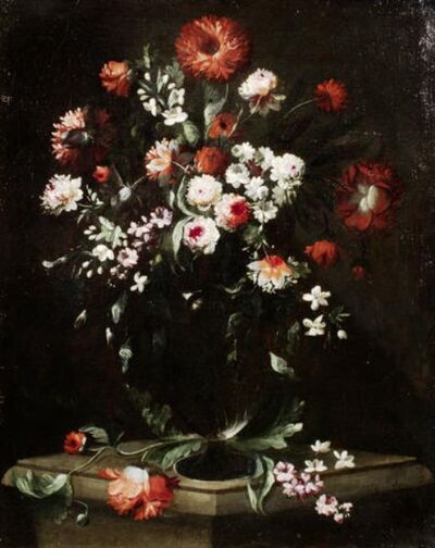 roses-carnations-and-other-flowers-in-a-glass-vase-on-a-stone-ledge