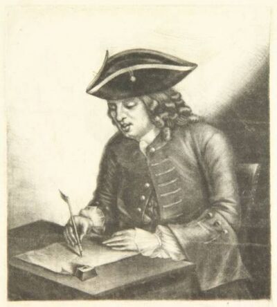 man-writing-at-his-desk