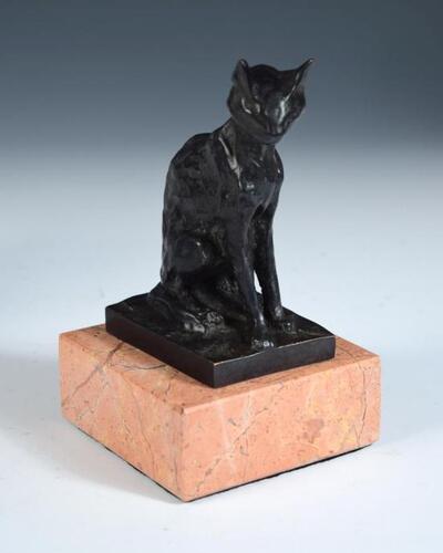 a-bronze-model-of-a-cat
