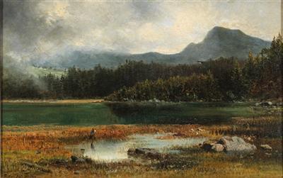 heron-by-a-tree-lined-mountain-lake