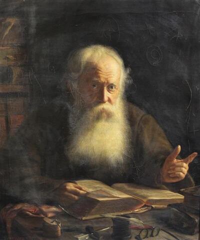 portrait-of-a-bearded-man-reading-a-book