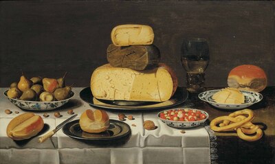 a-breakfast-piece-with-cheese-bread-fruit-and-a-roemer-on-a-partially-draped-table