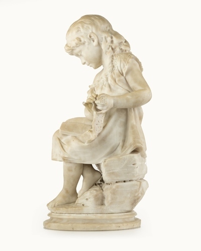 a-carved-marble-sculpture-of-a-young-girl-reading-a-book
