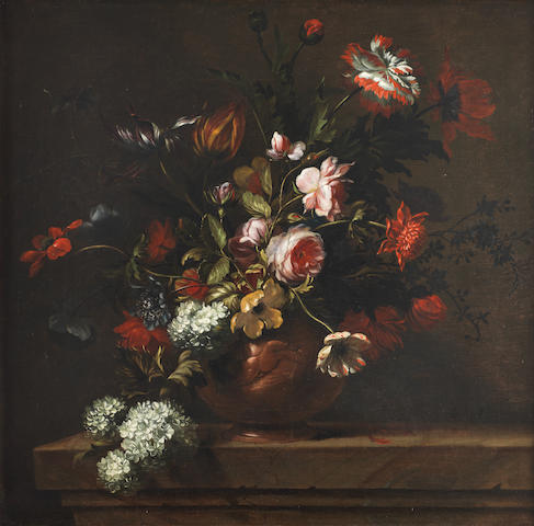 tulips-roses-snowballs-and-other-flowers-in-a-terracotta-vase-on-a-stone-ledge