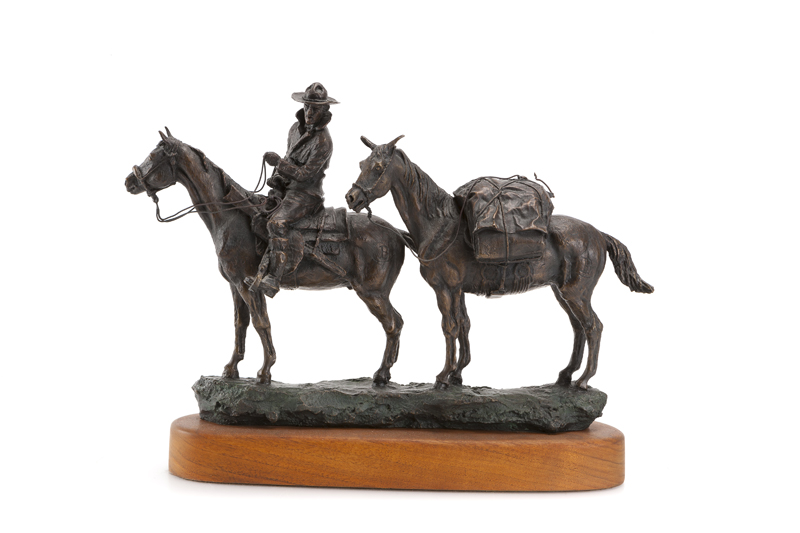 cowboy-on-horseback-and-pack-horse